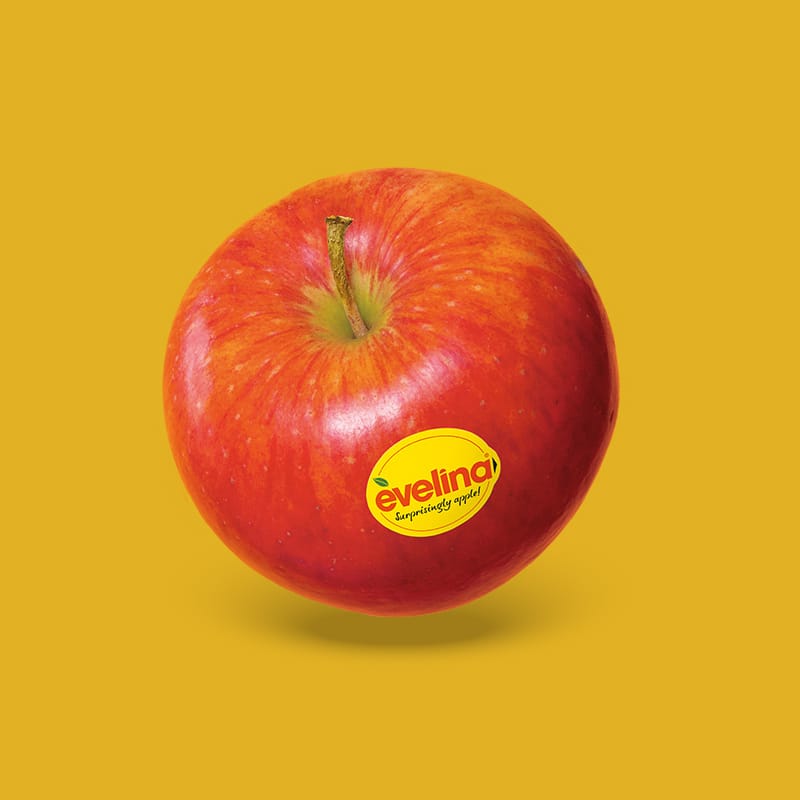 Roter Apfel auf gelbem Hintergrund.